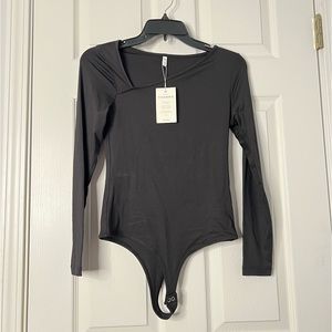 NWT ReoRia long sleeve asymmetrical top thong bodysuit